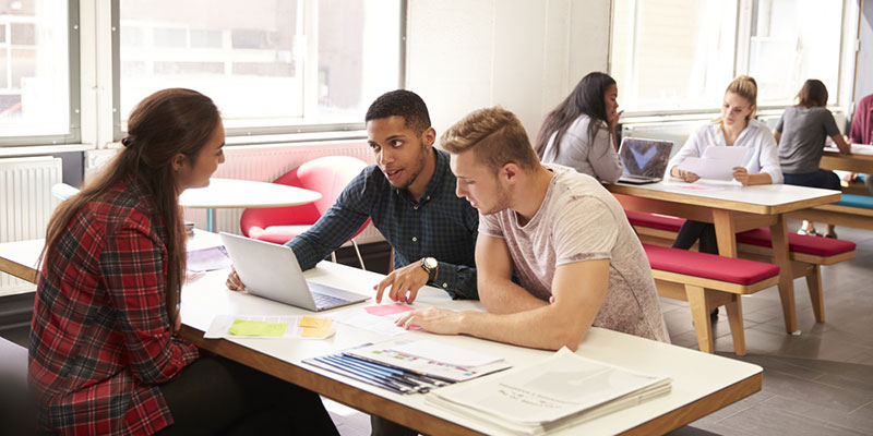 Three university students working together