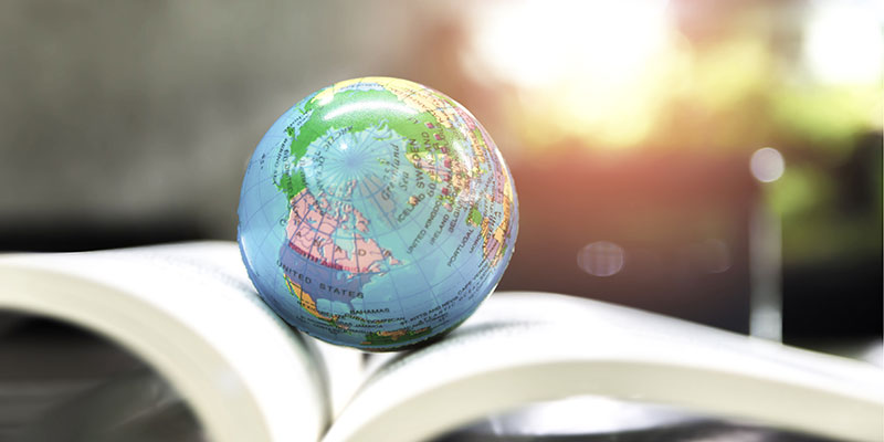 A globe resting on an open book