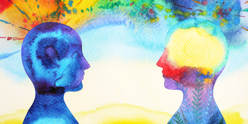 abstract image of two people facing each other with colours floating around them