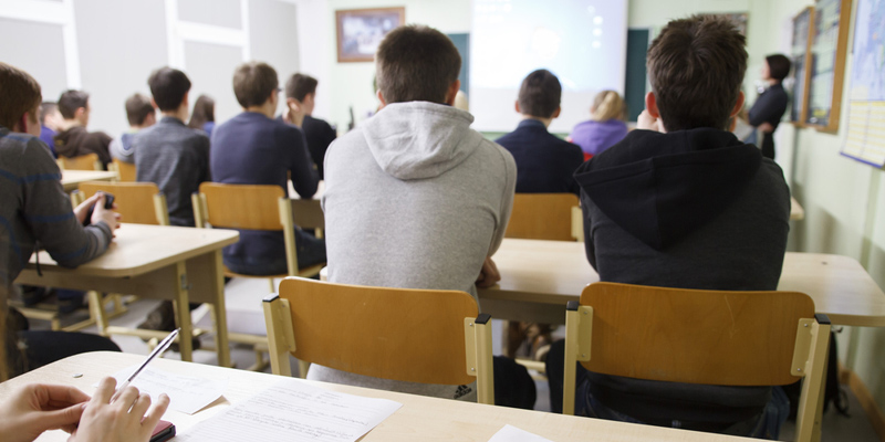 Students working at a table in classroom