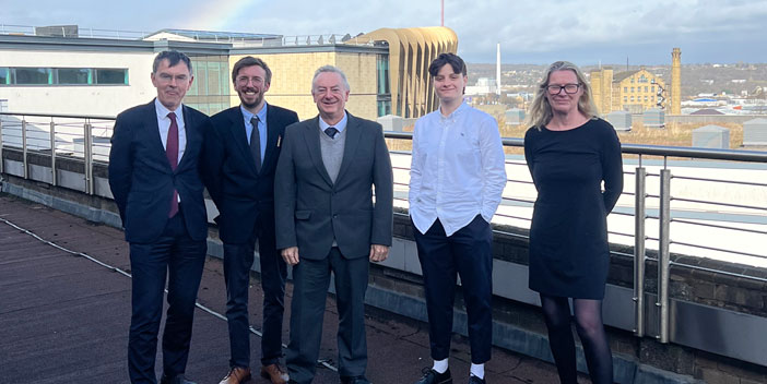 Risk Manager Maddy Cooper and Head of Regulatory Portfolio Liam Izod pose for a snap with the University of Huddersfield’s senior leadership team.