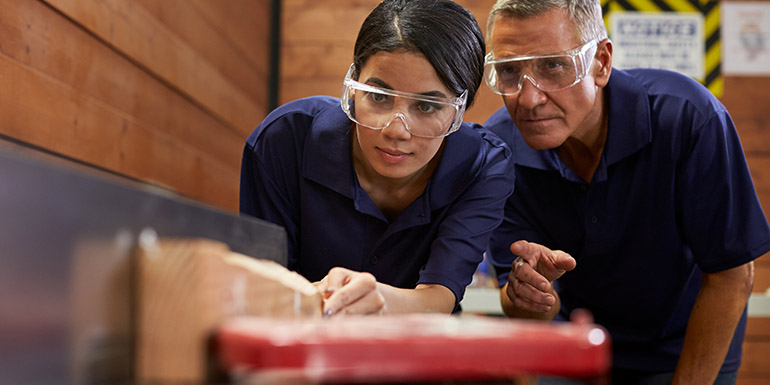 Stock photo of a student and teacher on a technical course.
