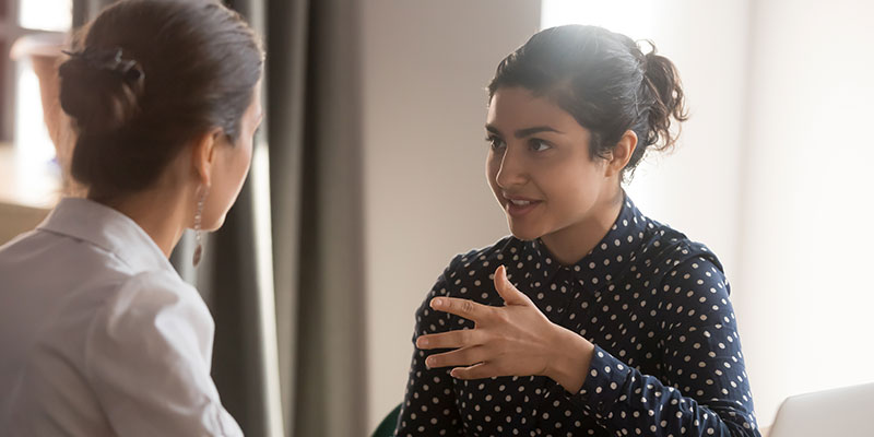 Two women talking