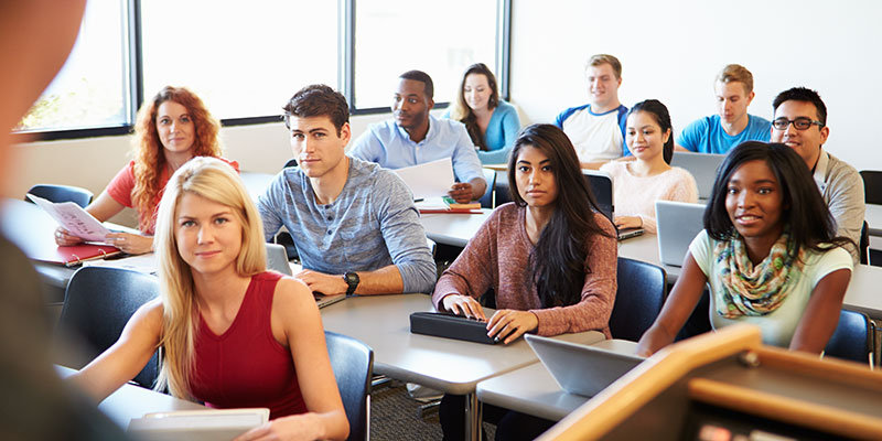 A classroom of students listening to a lecturer