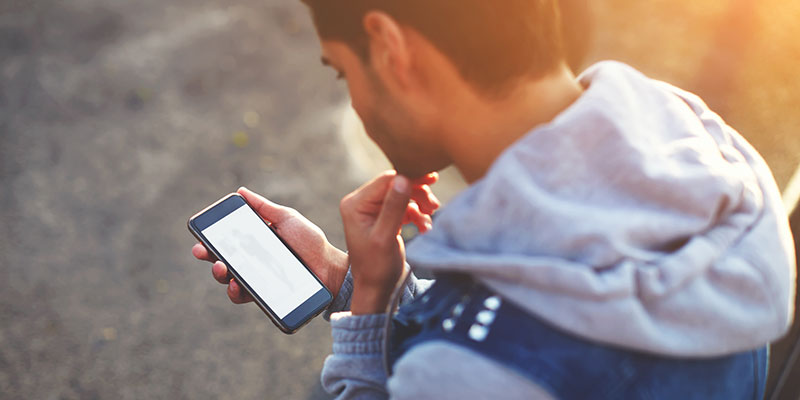 Student looking at mobile phone