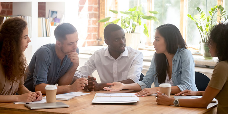 Five students talking