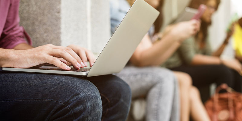 Close up of laptop on a student's knees