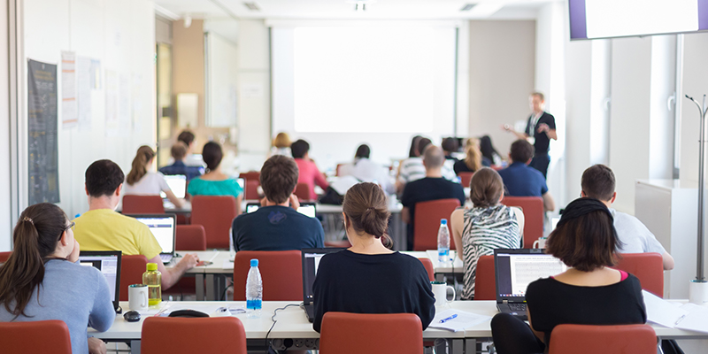 A photograph of a small classroom from the back