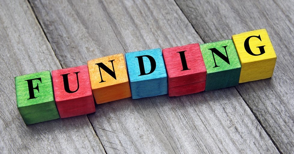 Wooden blocks spelling the word 'funding'