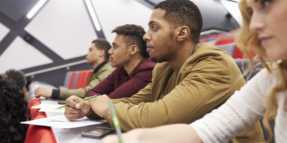 Students in lecture theatre taking notes