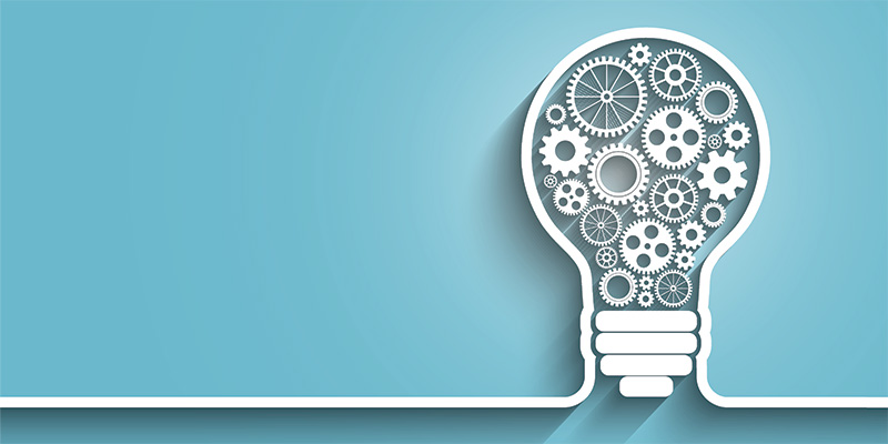 Outline of a lightbulb with various cogs and gears inside